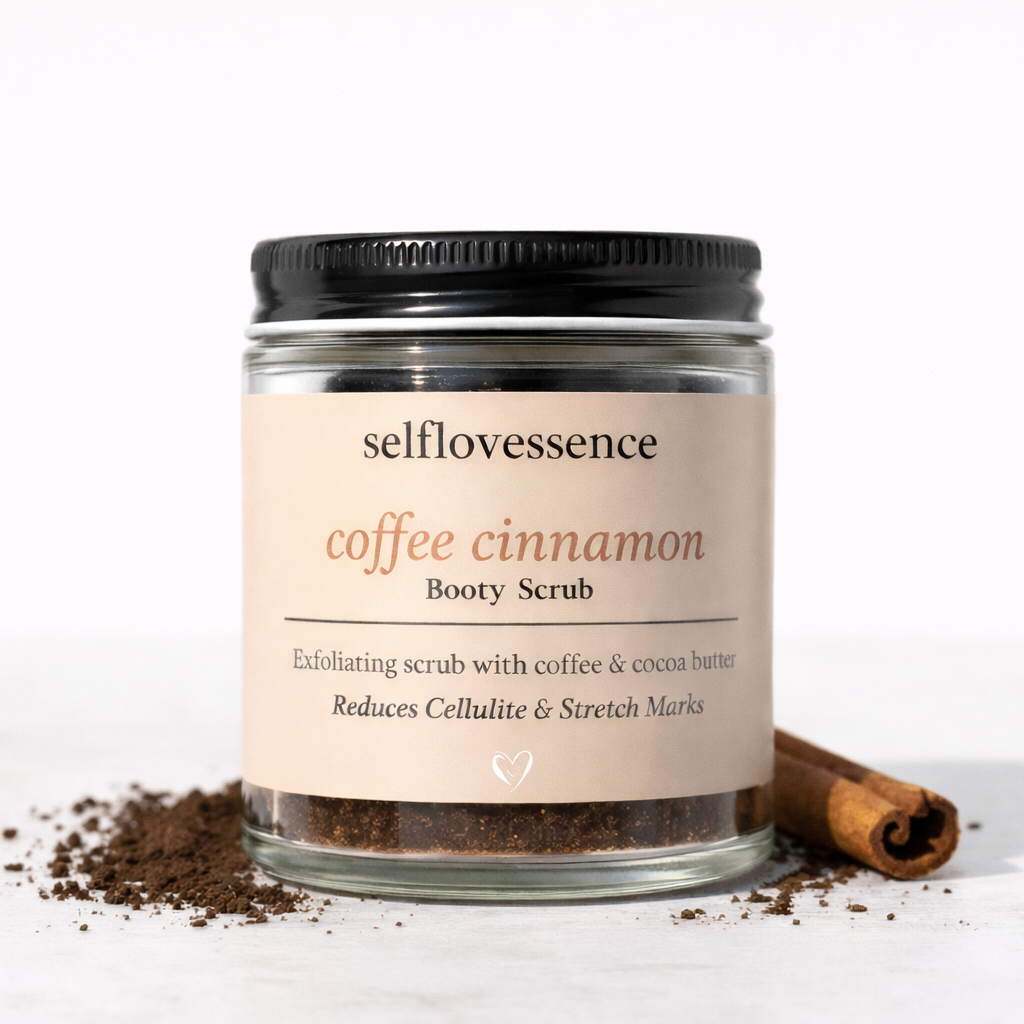 Jar of selflovessence coffee cinnamon body scrub with a cinnamon stick on a white background